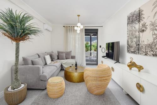 a living room with a couch and a table at Dimitris Residence in Tivat