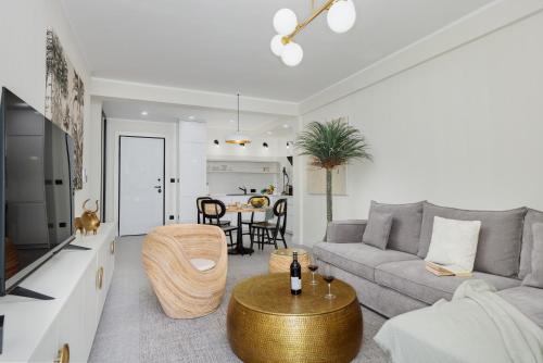a living room with a couch and a table at Dimitris Residence in Tivat