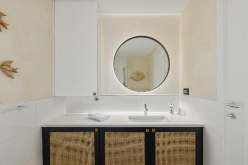 a bathroom with a sink and a mirror at Dimitris Residence in Tivat