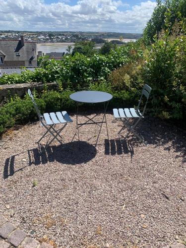 two chairs and a table and a table and two chairs at LE CAP in Erquy