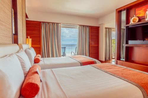 Voodi või voodid majutusasutuse Hotel Nikko Guam toas