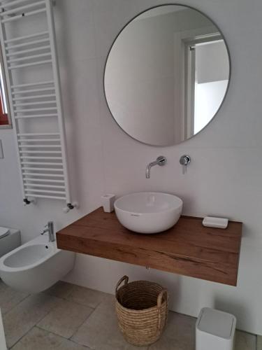 a bathroom with a sink and a mirror at Viale del Sole - le Dimore in Locorotondo