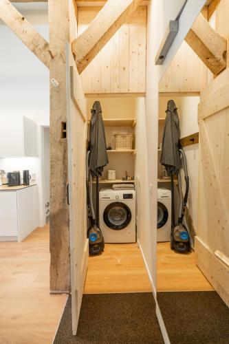 a room with a washer and dryer in a house at Reethus 22 Loft 2 in Timmendorfer Strand