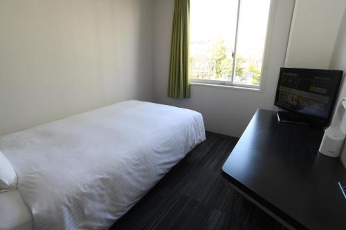 Postel nebo postele na pokoji v ubytování Washington R&BHotel TokyoToyocho