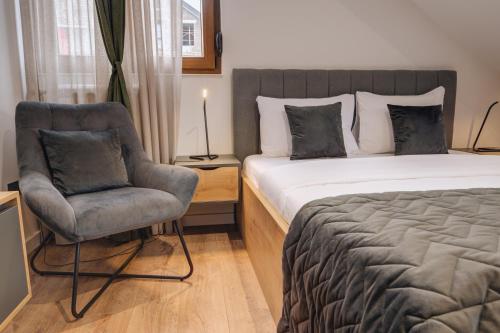 Una cama o camas en una habitación de Apartments Proforma