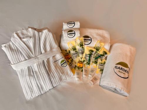 a group of towels and products on a counter at Garden Hotel in Bishkek
