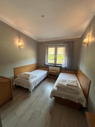 Postel nebo postele na pokoji v ubytování Zajazd Bias