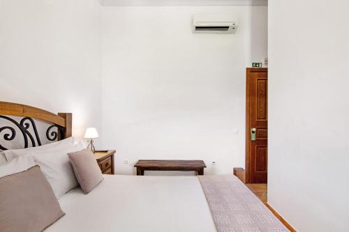 Katil atau katil-katil dalam bilik di Casas do Monte