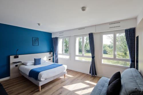 Postel nebo postele na pokoji v ubytování Hôtel Le Riccoty