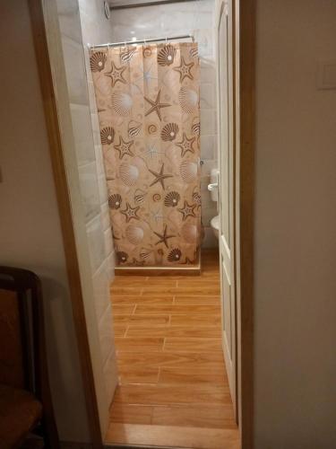 a hallway with a stairway with a patterned wall at rm castell apartments in Novi Sad