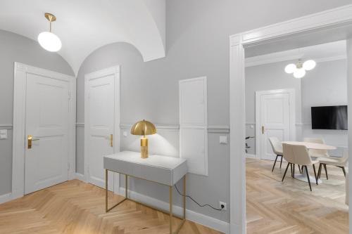 a white room with a table and a dining room at Residenz Hugo in Bad Schandau