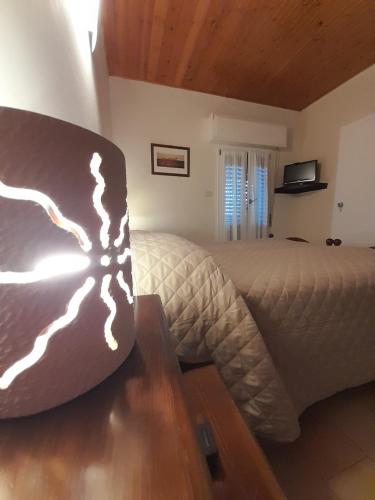 a bedroom with a bed and a table in it at Hotel Regina Yeti Bistrot in Sestola