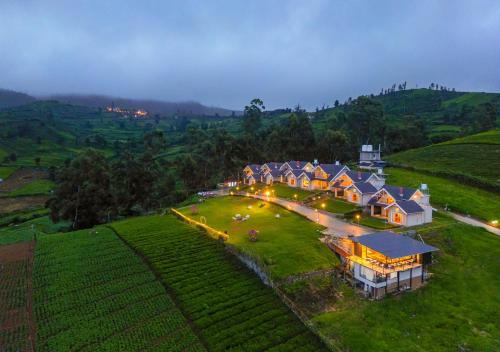 an aerial view of a house on a hill at AJ Gable Clouds Ooty by VOYE HOMES - Serene Stay Near Avalanche Emerald Lake in Ooty