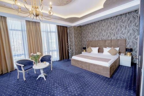 Voodi või voodid majutusasutuse Welcome Inn Hotel toas