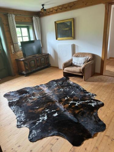 a living room with a fur rug on the floor at AU-4 Ferienwohnung in Lofer