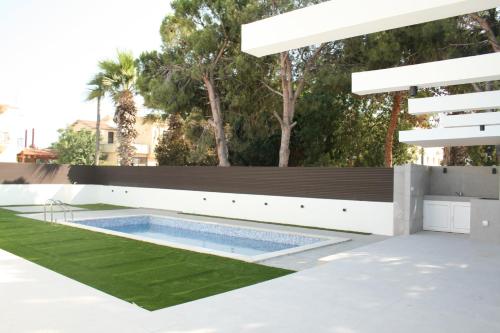 a swimming pool on the roof of a house at Pervolia Oasis Villa in Kiti