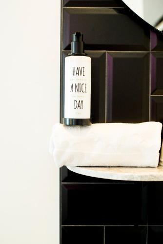 a bottle of have a nice day on a shelf at Citrea Santander in Santander