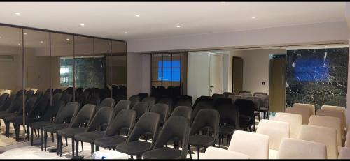 a room with rows of chairs in a building at Grand Hotel Kalamata in Kalamata