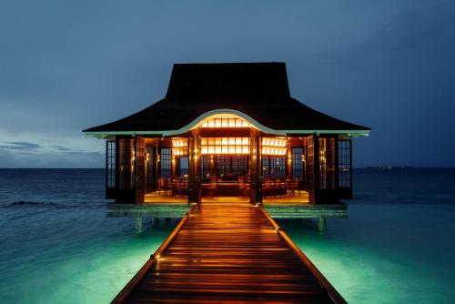 a house on the water in the middle of the ocean at Nova Maldives in Dhangethi