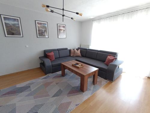 a living room with a couch and a coffee table at DreamHouse in Jajce