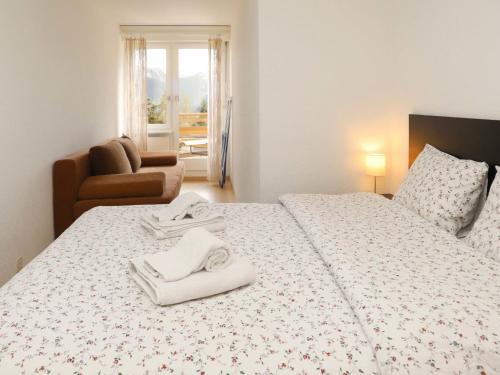 Ένα ή περισσότερα κρεβάτια σε δωμάτιο στο Apartment Terrasse Des Alpes 815 by Interhome