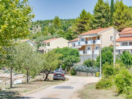 a street in a residential neighbourhood with cars parked at Apartment Daria 2 by Interhome in Anić