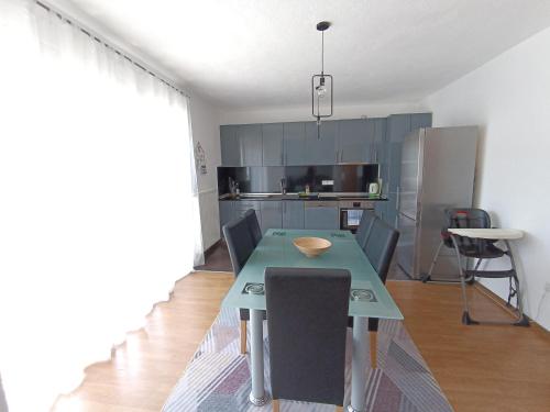a kitchen with a table and chairs in a room at DreamHouse in Jajce
