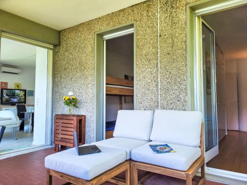 a living room with a couch and two chairs at Apartment Frontlake Panorama Apt- 408 by Interhome in Bissone