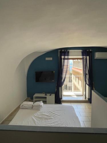 Postel nebo postele na pokoji v ubytování Antonietta home