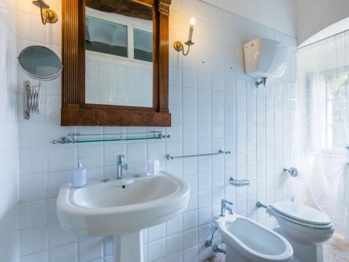a bathroom with a sink and a toilet at Apartment Torre 2 by Interhome in Stigliano