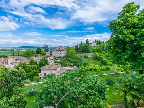 an aerial view of a village with houses and trees at Holiday Home La Torre-4 by Interhome in Stigliano