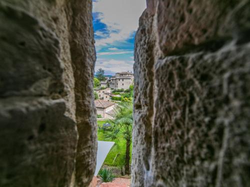 a view from a stone wall looking out at a city at Apartment Torre 4 by Interhome in Stigliano