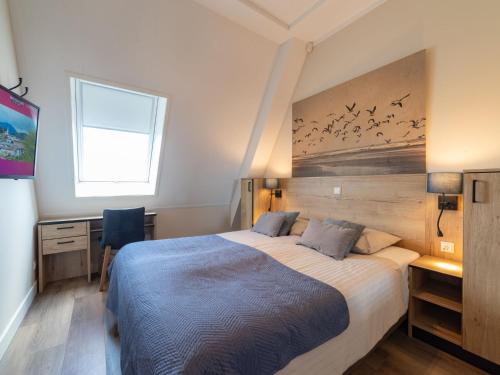 Ένα ή περισσότερα κρεβάτια σε δωμάτιο στο Apartment Ganuenta-1 by Interhome