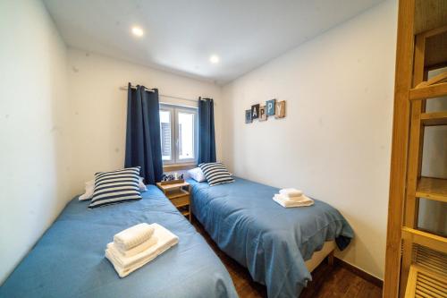 Ένα ή περισσότερα κρεβάτια σε δωμάτιο στο Casa Estrela do Mar