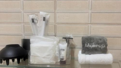 a counter top with a toothbrush and a towel at Citrine-dreamy Mall Studio Unit in Crown Point