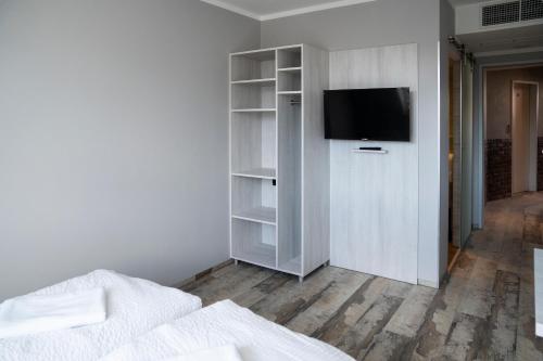 TV a/nebo společenská místnost v ubytování Do Step Inn Meidling - Self-Service-Hotel