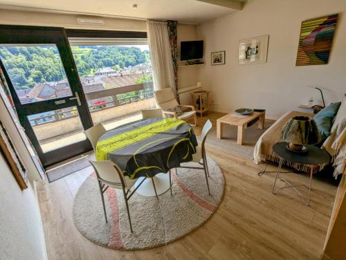 a room with a bed and a room with a window at villa deloro in Orbey