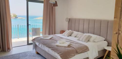 a bedroom with a bed with two towels on it at Augusta in Lastovo