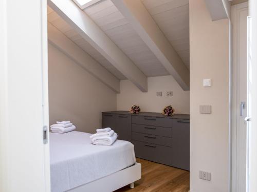 a bedroom with two beds and a dresser at Apartment Casa Calleri by Interhome in Briaglia