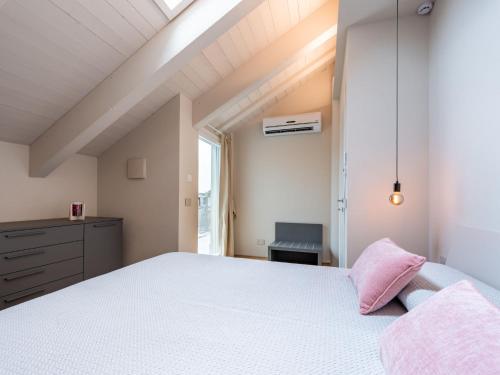 a bedroom with a white bed and a window at Apartment Casa Calleri by Interhome in Briaglia