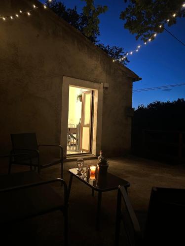 a table with a candle on a patio at night at B&B La Majella Me in Abbateggio