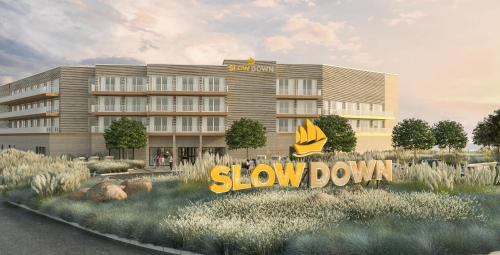 a rendering of a slow down hotel building at SlowDown Bottsand Hotel und Spa in Wendtorf