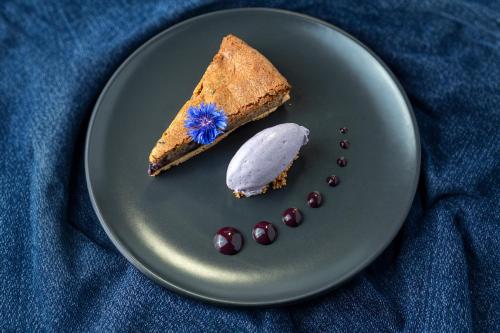 a plate with a piece of cake on a table at Northgate House in Buckfastleigh
