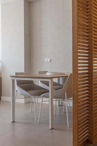 a dining room table with chairs around it at Bordoy Cosmopolitan in Playa de Palma