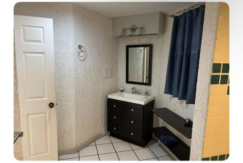 a bathroom with a sink and a mirror at Cabo Oasis At Misiones in Cabo San Lucas