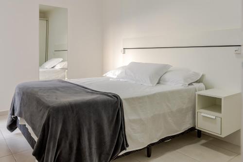 Postel nebo postele na pokoji v ubytování Vista Atlântico: Cond. Arborizado em Itapema P1474