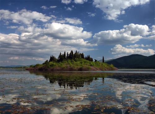 a small island in the middle of a body of water at Villa Matko - family destination in Zmijavci