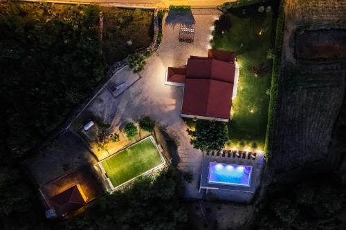 an overhead view of a backyard at night with a swimming pool at Villa Matko - family destination in Zmijavci