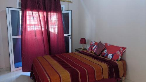 Кровать или кровати в номере Appartements de Vacances Près de la Plage Perle Bleue Saidia