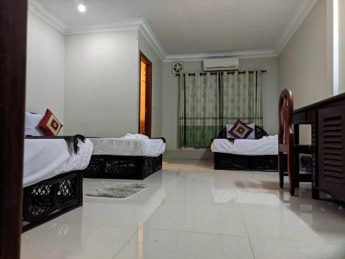 Katil atau katil-katil dalam bilik di IKI IKI Guesthouse
